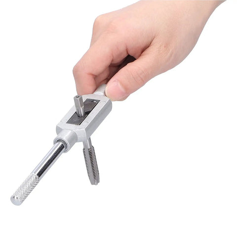 Premium 8-Piece Tap And Die Set Made With Tough Alloy Steel For Clean Metric Threading On Pipes And Hard Metals Like Aluminum And Carbon Steel Without Damage Or Stripping Includes Wrench And Seven Taps hand holding tap wrench with die and tap