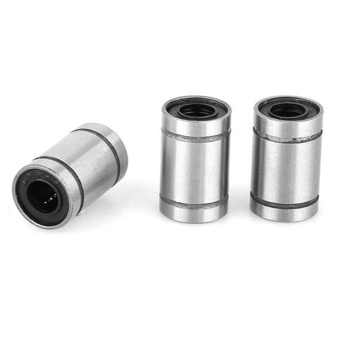 Angled view of 8pc LM6UU linear ball bearings, 6mm inner diameter, metal housings for engraving machine shafts