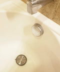 Bathroom Sink And Tub Hair Catcher 2 Pack Non Slip Drain Protector Anti Clog Filter in a bathtub view protecting drain.