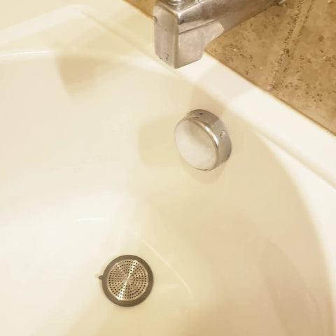 Bathroom Sink And Tub Hair Catcher 2 Pack Non Slip Drain Protector Anti Clog Filter in a bathtub view protecting drain.