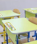 50 Pack Hot Air Balloon Style Desk Nameplates For Students, Bright Classroom Name Tags on yellow desks, colorful balloon decor.