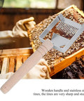 Sturdy Stainless Honeycomb Uncapper Fork With Wooden Handle For Beekeeping Pro Grade Heavy Duty Uncapping Tool in use on honeycomb.