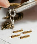 Clock Tension Springs Replacement Kit For Wall Clocks And Alarm Clocks with alloy springs and chain detail