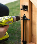 Installing Beefy Heavy Duty Cane Bolt Door Latch Half Inch By Eighteen Inch Black Steel Gate Hardware on a wooden gate