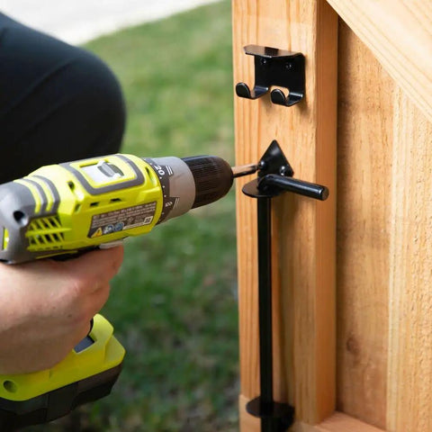 Installing Beefy Heavy Duty Cane Bolt Door Latch Half Inch By Eighteen Inch Black Steel Gate Hardware on a wooden gate