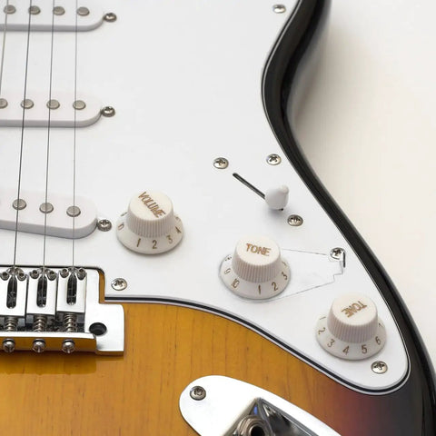 Close-up of electric guitar control plate with Metal Guitar Knob Position Markers 10 Piece Dope Set Indicator Plates for tone and volume control.