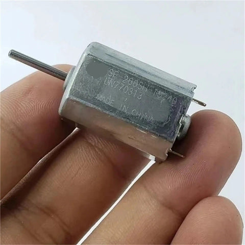 Tiny 18mm Square DC Motor 12V 18V 24V Micro 6 Pole Rotor Electric Motor For Industrial Use, held between fingers.