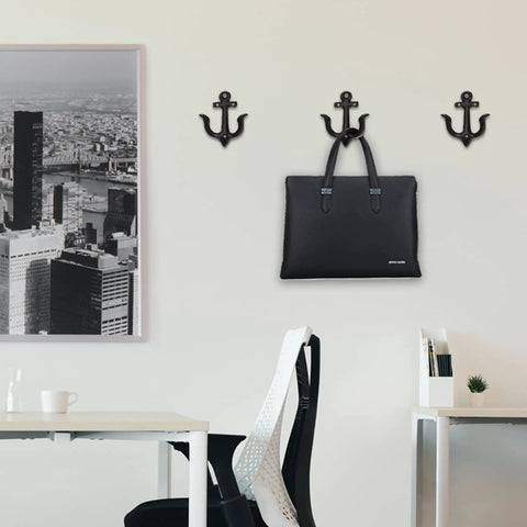 Nautical Sea Anchor Wall Hooks Set Of Four Cast Iron Vintage Coat Rack Heavy Duty Hangers For Bathroom Hallway Rustic Farmhouse Home Decor Built Different With Mounting Screws Black displaying a black bag.