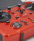 Close-up of Tandem X20R Dual Band Transmitter controls and dials for 2.4Ghz and 900Mhz RF Link, highlighting red casing.
