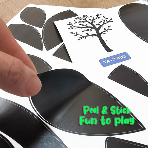 Close-up of Black Tree Wall Stickers For Living Room And Bedroom Decor Peel And Stick Tree Silhouette Decal being applied