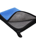 Folded blue and gray microfiber towel with black trim
