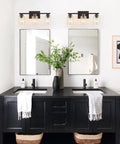 Dual Sleek Matte Black 3 Light Vanity Lights with Clear Glass Shades in modern bathroom setting.