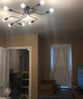 Black Sputnik Ceiling Light Fixture With Eight Adjustable Arms Industrial Semi Flush Mount Chandelier installed in living room