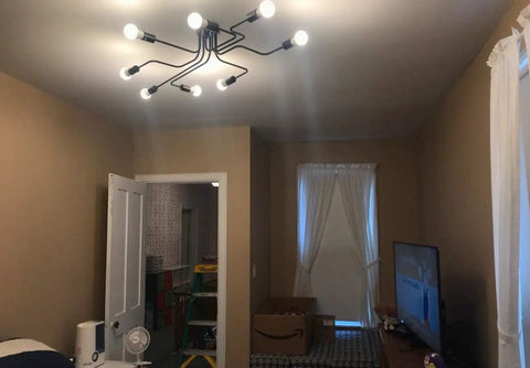Black Sputnik Ceiling Light Fixture With Eight Adjustable Arms Industrial Semi Flush Mount Chandelier installed in living room