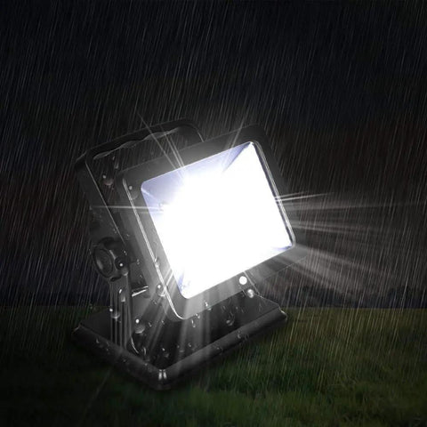Magnetic 15W LED Work Light With 180 Degree Rotation Waterproof Spotlight shining brightly in rain
