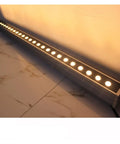 Top Shelf Cool White Six Thousand Kelvin Led Wall Washer Light For Indoors Outdoors sleek linear floodlight on floor with warm glow.
