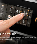 Close-up of finger pressing button on Fully Automatic Espresso Machine With Built In Grinder And LatteGo Milk Frother.