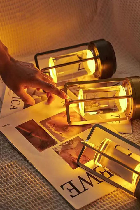 Portable Metal Table Lamp Cordless Rechargeable LED Light With 3 Color Infinitely Dimming Battery Powered Small Desk Lamp For Indoor Outdoor Use Ideal For Home Bar Cafe Camping In Sleek Gold illuminating a magazine.