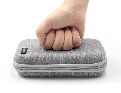 Rock Solid Hardshell Diabetes Travel Case Bag for Diabetic Supplies being pressed, showcasing its durable EVA fabric and canvas exterior.
