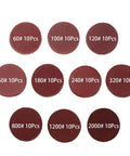 Top Notch 2 Inch Red Sanding Discs Pad Kit With Up To 102 Pieces Offering Smooth Wood And Metal Finishing For Drilling Grinding And Polishing Tasks Across Multiple Grit Levels From 60 To 2000 For Serious DIYers, showing various grit sandpaper discs.