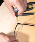 Close-up of Tiny 8 Piece Mini Precision Screwdriver Set For Electronics And Terminal Blocks with cushion grip handles in use.