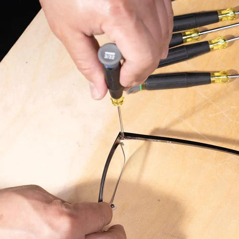 Close-up of Tiny 8 Piece Mini Precision Screwdriver Set For Electronics And Terminal Blocks with cushion grip handles in use.