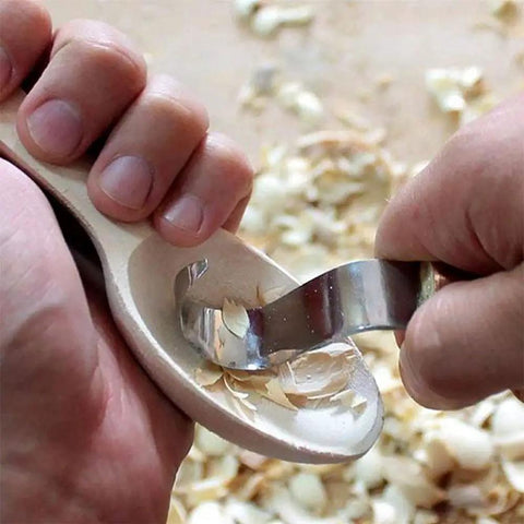 Kickass Stainless Steel Spoon Carving Knife And Hand Chisel Tools With Slick Ergonomic Grip carving a wooden spoon.
