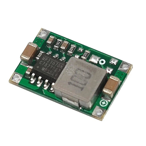 Close-up of Ten Pack Dope 3.3V Buck Converter Module From 5-24V Input To 3.3V Output, showing components on green PCB.