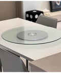 Dang Solid Heavy Duty Tempered Glass Lazy Susan Turntable for Family Dinners on a modern kitchen table.