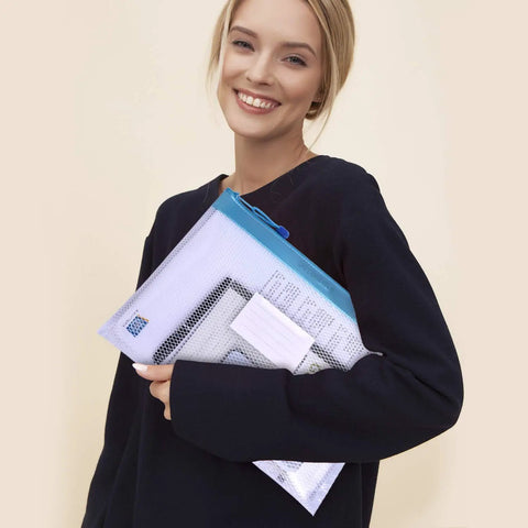 Person holding Four Pack Durable Letter Size Waterproof Mesh File Bags For Documents And Everyday Carry Zipper Pouch Organizers In Blue.
