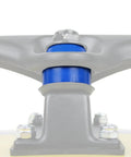 Premium American Longboard And Skateboard Truck Replacement Bushings 4 Pack Soft 88a Blue Cushions mounted on a skateboard truck.