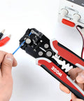 Using Self Adjusting Wire Stripper Tool For AWG Ten To Twenty Four Strips Cuts And Crimps Copper And Aluminum Wires 8 Inch Automatic 3 In One Pliers With Thumbwheel Adjustment to strip a blue wire