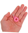 Hand holding a pink charm from Six Pack Silicone Straw Charm Adapters For Tumblers, Stylish And Fun Straw Pendants For Home Parties Cafes And Gatherings