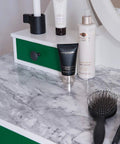 Marble-effect surface using Romeo Marble Self Adhesive Film 17 By 78 Inches Three Pack with applicator on a green cabinet top