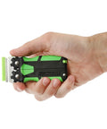 Hand holding green and black tool from 11 Piece Multi Purpose Razor Blade Scraper Kit With 10 Blades For Window Glass Sticker Removal And Flat Edge