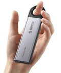 Person holding 512GB Portable SSD With 460MB/s Speed, Hook Design External Drive With USB-C And USB-A 2-In-1 Cable