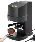 Plug Play Automatic Espresso Tamper With Built In Cleaning Stand And Adjustable 22 To 66 Lbs Pressure Dial with coffee grounds.