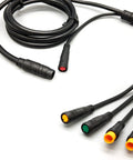 Waterproof 9 Pin Electric Bike Cable Kit For 1T5 And 1T4 Controllers with multicolored connectors on white background