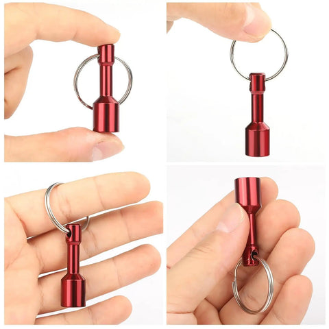 Hand holding a red metal keychain from the 10 Pack Keychain Magnets for Gold and Jewelry Testing - Neodymium Pocket Magnetic Tester Kit.