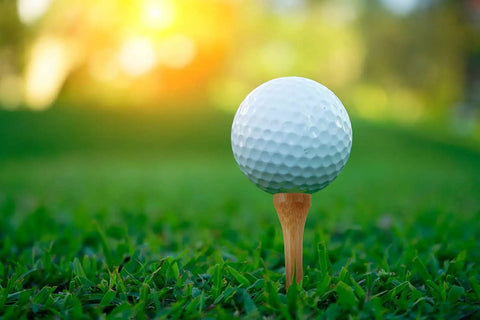 Golf ball on Pro Grade Bamboo Golf Tees Two And Three Quarters Inch Pack Of One Hundred Built To Last On The Course in grass