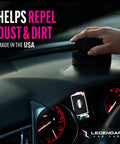 Hand using Dope Shine Gloss Dressing With Applicator 16oz Tire Shine Spray And Plastic Restorer For Cars on car dashboard