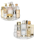 Smooth Spin Bathroom Vanity Tray For Counter 2 Pack 9 Inch Rotary Makeup Organizer showing skincare products organized on clear trays.