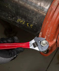 Extra Capacity Adjustable Wrench Built For Tight Spots And Big Jobs, Forged Alloy Steel Jaw, High Polish Chrome Finish, 8 Inch Size, Precision Machined For Smooth Operation in use on a large pipe