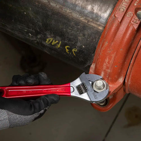 Extra Capacity Adjustable Wrench Built For Tight Spots And Big Jobs, Forged Alloy Steel Jaw, High Polish Chrome Finish, 8 Inch Size, Precision Machined For Smooth Operation in use on a large pipe