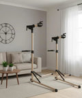 Foldable Aluminum Bike Repair Stand With Height Adjustable Arm set up in living room, showcasing its portable and stable design.
