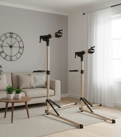 Foldable Aluminum Bike Repair Stand With Height Adjustable Arm set up in living room, showcasing its portable and stable design.
