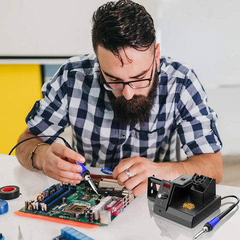 Man using Digital Soldering Station With PID Temperature Control, 80W 110V Soldering Iron Kit on a circuit board