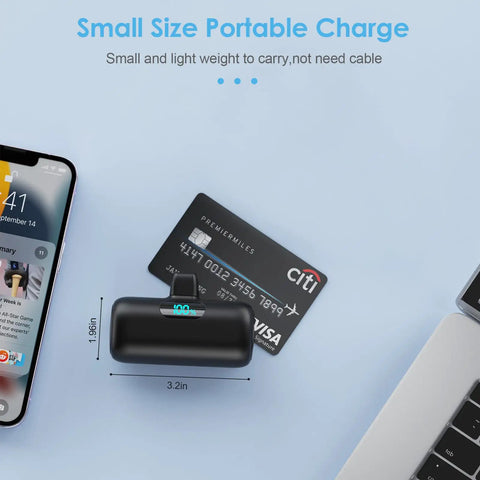 Nifty 5000mAh PD Fast Charging Power Bank For iPhone 14 And 13 Series slim charger on table with phone, 3.2 by 1.96 inches, direct plug design.