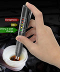 Brake fluid tester front view: black handheld device with 5 LED indicators for DOT3/DOT4 moisture test