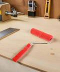 Knockout 2 Piece Wood Grain Texture Paint Roller Pair Featuring Rock Solid Grip Handle For Quick Drywall Mud Work and Real Deal Fake Timber Finish Results That Truly Stand Out on workshop table.